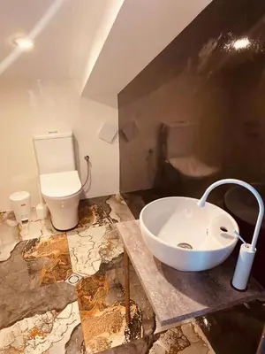 a bathroom with a sink and a toilet at Вила ОмниЯ in Chernomorets