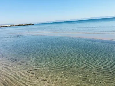 a beach with a body of water at Rent Apartments Martin Beach in Pomorie