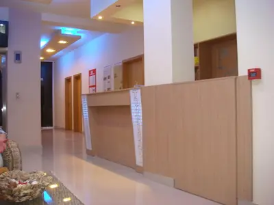 a lobby with a reception desk in a building at ТРОПИКАНА in Primorsko