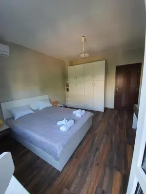 a bedroom with a bed with towels on it at Danny apartment in Burgas City
