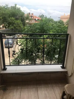 a balcony with a view of a yard at GUEST HOUSE ZORNICA in OBZOR in Obzor