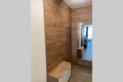 a bathroom with wooden walls and a shower at Studio 13 in Varna City