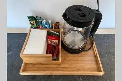 a wooden tray with a coffee maker and a blender at Studio 13 in Varna City