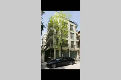 a black car parked in front of a building at The Cozy Studio, Varna City Centre in Varna City