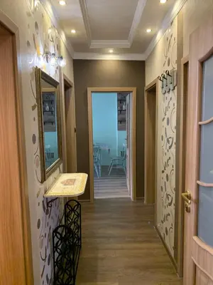 a hallway leading to a room with a table and a mirror at Boutique House Belevi in Nesebar