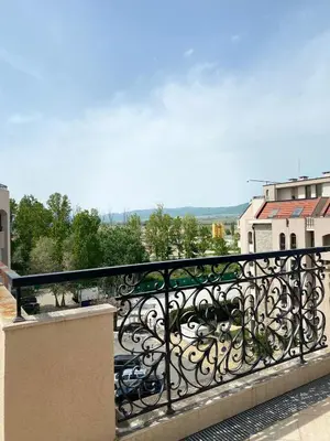 a balcony with a black railing on a building at Dawn Park Deluxe in Sunny Beach