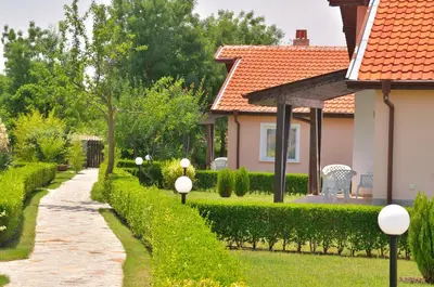 a garden with a pathway and a house at BulgariaVilla - Sunny Hills Villas in Bryastovets