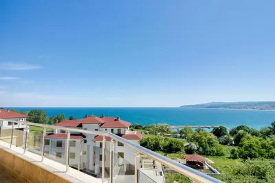 a balcony of a house with a view of the ocean at Byala Panorama Resort in Byala