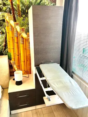 a bunk bed with a ladder next to a window at Avelov Art Apartment in Burgas City