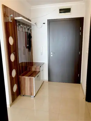 a bathroom with a black door and a tile floor at Private Super apartments by sea in Apart Hotel ! in Pomorie