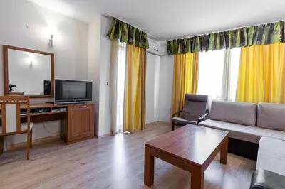 a living room with a couch and a tv at Avalon appartament da Lary in Sunny Beach