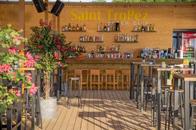 a restaurant with tables and stools in front of a store at ELIA MARe Hotel ALL Inclusive - Free Beach Access in Kiten