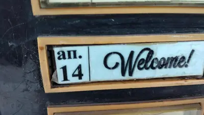 a plate on a wall with a sign on it at Варна Хостел in Varna City