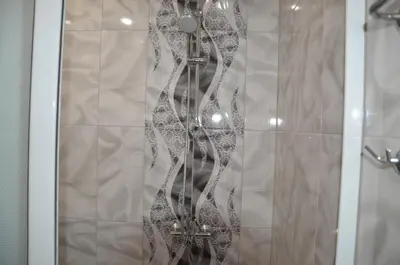 a shower with a glass door with a shower curtain at Sania in Obzor