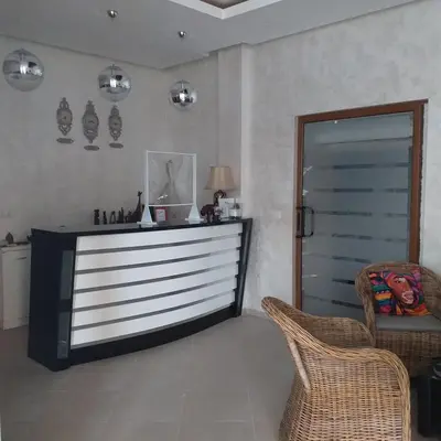 a living room with a dresser and a chair at Time out in Sozopol