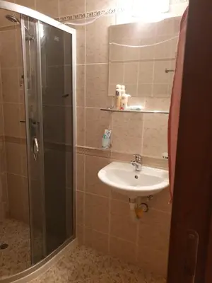 a bathroom with a sink and a glass shower at Hotel Royal Dreams Privat Apartment in Sunny Beach