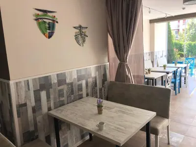 a dining room with a table and some chairs at Hotel Pacific Palma in Sunny Beach
