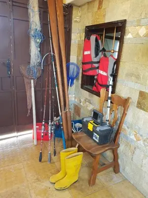 a room with a bunch of equipment and yellow rubber boots at Апартамент КИМАКО, 100м2 на цена за хотелска стая за двама in Tsarevo