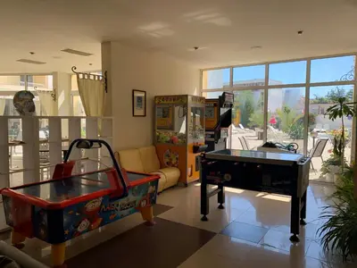 a living room with a pool table and a couch at Sun Palace Hotel - All Inclusive in Sunny Beach
