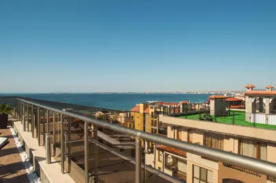 a view of the ocean from the balcony of a building at Луксозен апартамент Свети Влас Вила Аристо in Sveti Vlas