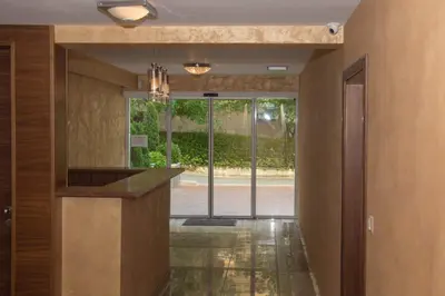a lobby with a view of the entrance to a building at Луксозен апартамент Свети Влас Вила Аристо in Sveti Vlas