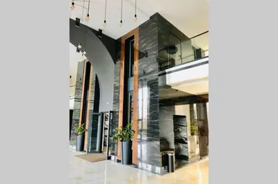 a lobby of a building with a glass wall at Luxury Apartment Azure Coast Panorama in Burgas City