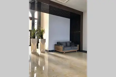 a living room with a couch and a chair at Luxury Apartment Azure Coast Panorama in Burgas City