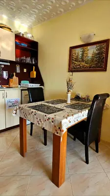 a table in a kitchen with a table sidx sidx sidx at Курортно студио in Sunny Beach