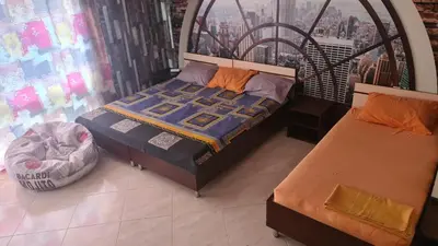 a bedroom with two beds and a window at Курортно студио in Sunny Beach
