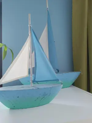 a toy sail boat sitting on a shelf at Guest House Soirée in Nesebar