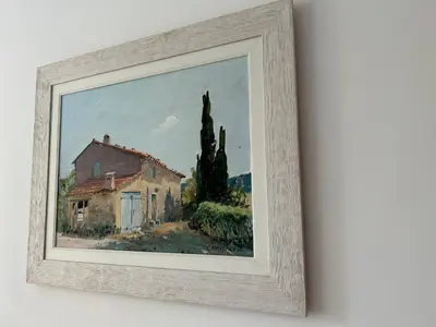 a painting of a house and trees on a wall at Sozopoli Hills Apartment A6 in Sozopol