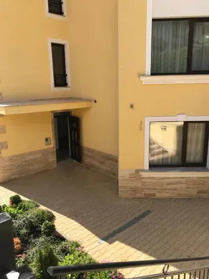 a side view of a building with a door at Horizon Katrina Apartments - Sea line & Beach Access in Sveti Vlas