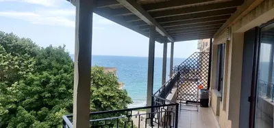 a balcony with a view of the ocean at Ravda on the Beach in Ravda