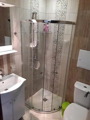 a shower in a bathroom with a sink and a toilet at PARADISO 'В' 310 Private Room Nessebar in Nesebar