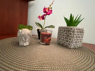 a table with vases and a drink on a table at Bar & Guests room ELA in Dolen Bliznak