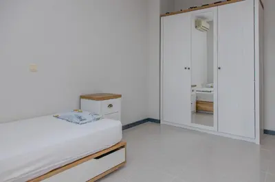 a bedroom with a bed and a large mirror at Lovely 3BD flat with PARKING and SEA VIEW by Flаt Manаger in Chernomorets