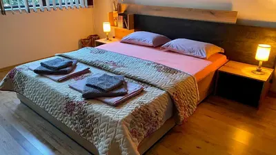 a bedroom with a bed with towels on it at Sozopol Dreams apartman 35 in Sozopol