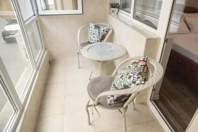 a small room with two chairs and a table at Apartment MARTINI in Burgas City