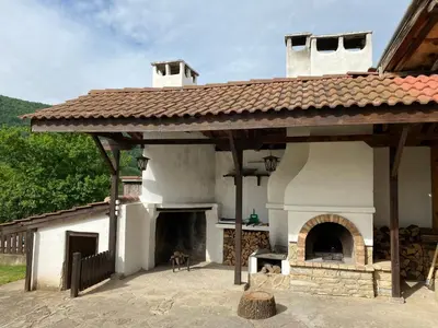 a large white building with a large oven at СЪНТОВЕЦ - на брега на язовир Цонево in Tschenge