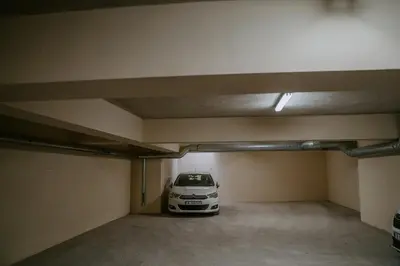a car parked in an empty parking garage at Bella's Sea apartment-Beach, Sea garden ,Old Town, Free Parking, Free EVcharging Station in Varna City