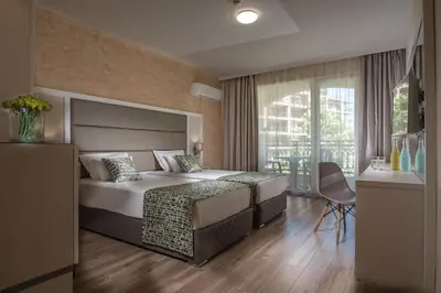 a bedroom with a bed and a large window at Marina Sands Bijou Boutique - excellent choice for travelers visiting Obzor 2-4p in Obzor