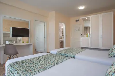 a hotel room with two beds and a television at Marina Sands Bijou Boutique - excellent choice for travelers visiting Obzor 2-4p in Obzor
