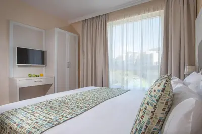 a hotel room with a bed and a large window at Marina Sands Bijou Boutique - excellent choice for travelers visiting Obzor 2-4p in Obzor