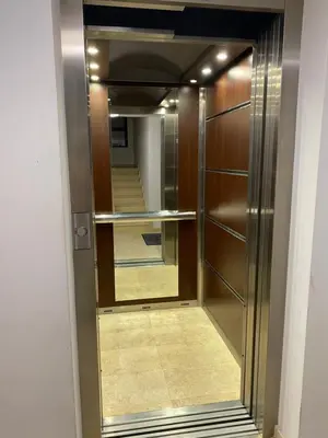 a walk in closet with a mirror and a hallway at Stylish URBAN Apart New 2021 Close to the Beach in Varna City