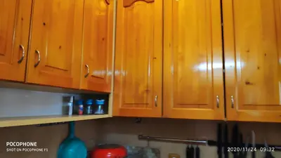 a bunch of wooden cabinets in a kitchen at UNIQUE LOCATION APARTMENT WITH PARKING in Burgas City