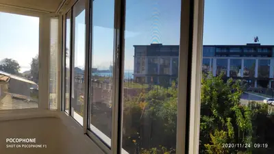 a room with windows with views of a city at UNIQUE LOCATION APARTMENT WITH PARKING in Burgas City