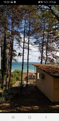 a small house with a view of the ocean at CarolMike Oasis Beach Apartment Kamchia Reserve in Kamchia