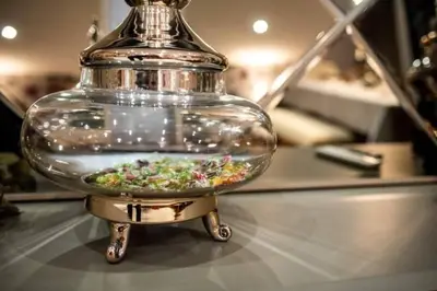 a glass jar with a bowl of food in it on a table at A&K COZY ART Studio 1 in Varna City