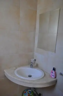 a bathroom with a sink and a mirror at Beautiful family villa with sea view in Byala