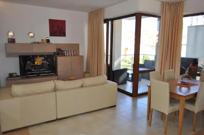 a living room with a couch and a table at Beautiful family villa with sea view in Byala